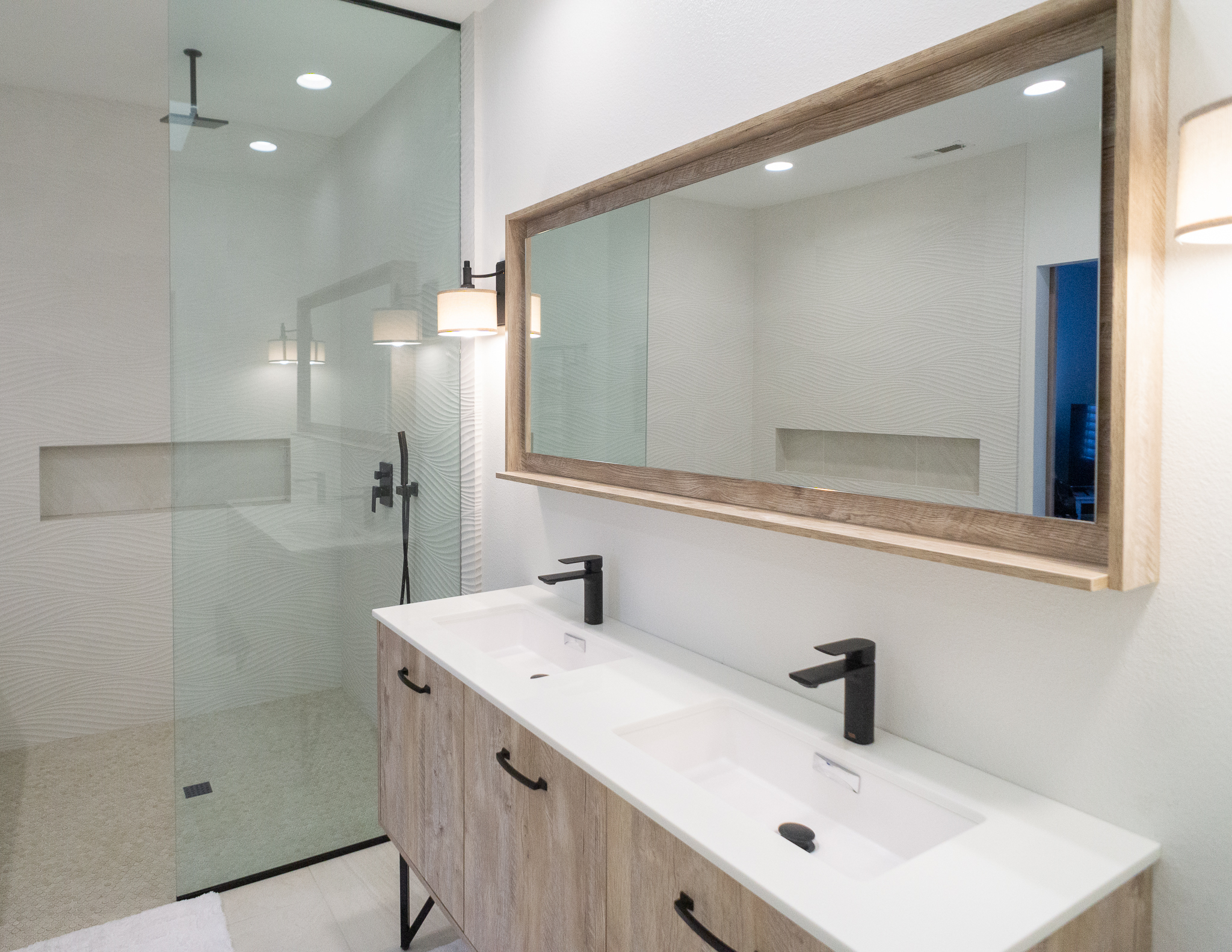 Palm Desert Whole-Home Renovation — master bath with floating wood vanity, frameless glass shower, wave tile