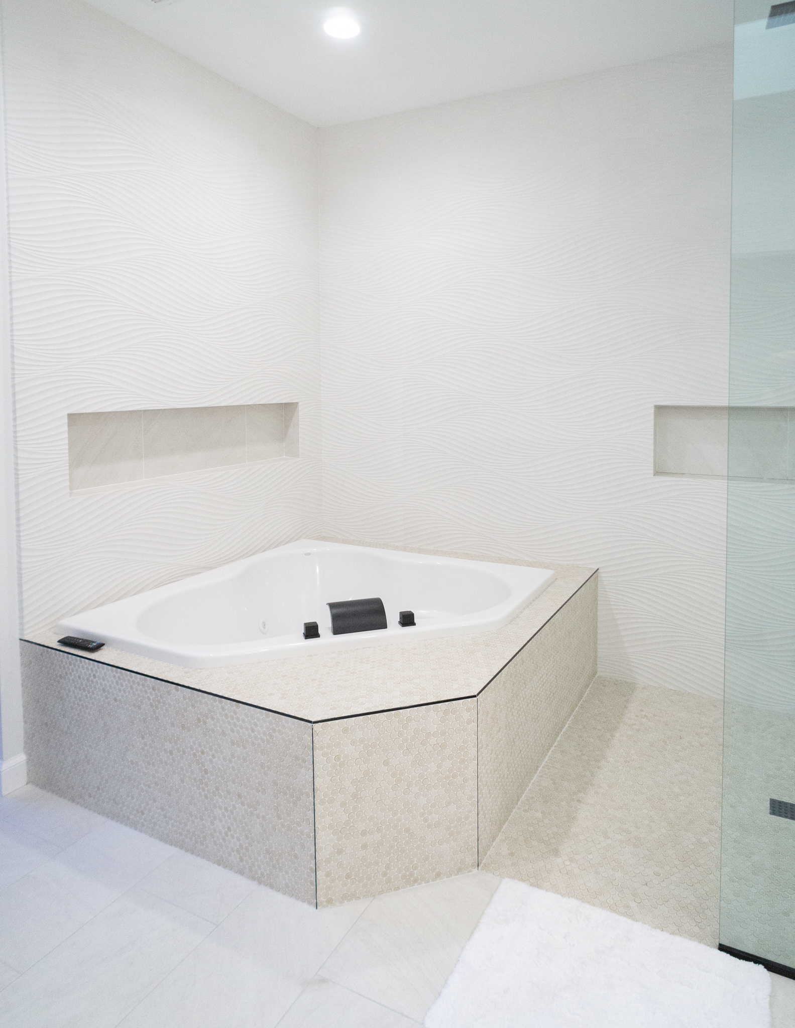 Palm Desert Whole-Home Renovation — spa bath corner soaking tub with penny tile surround and frameless glass shower