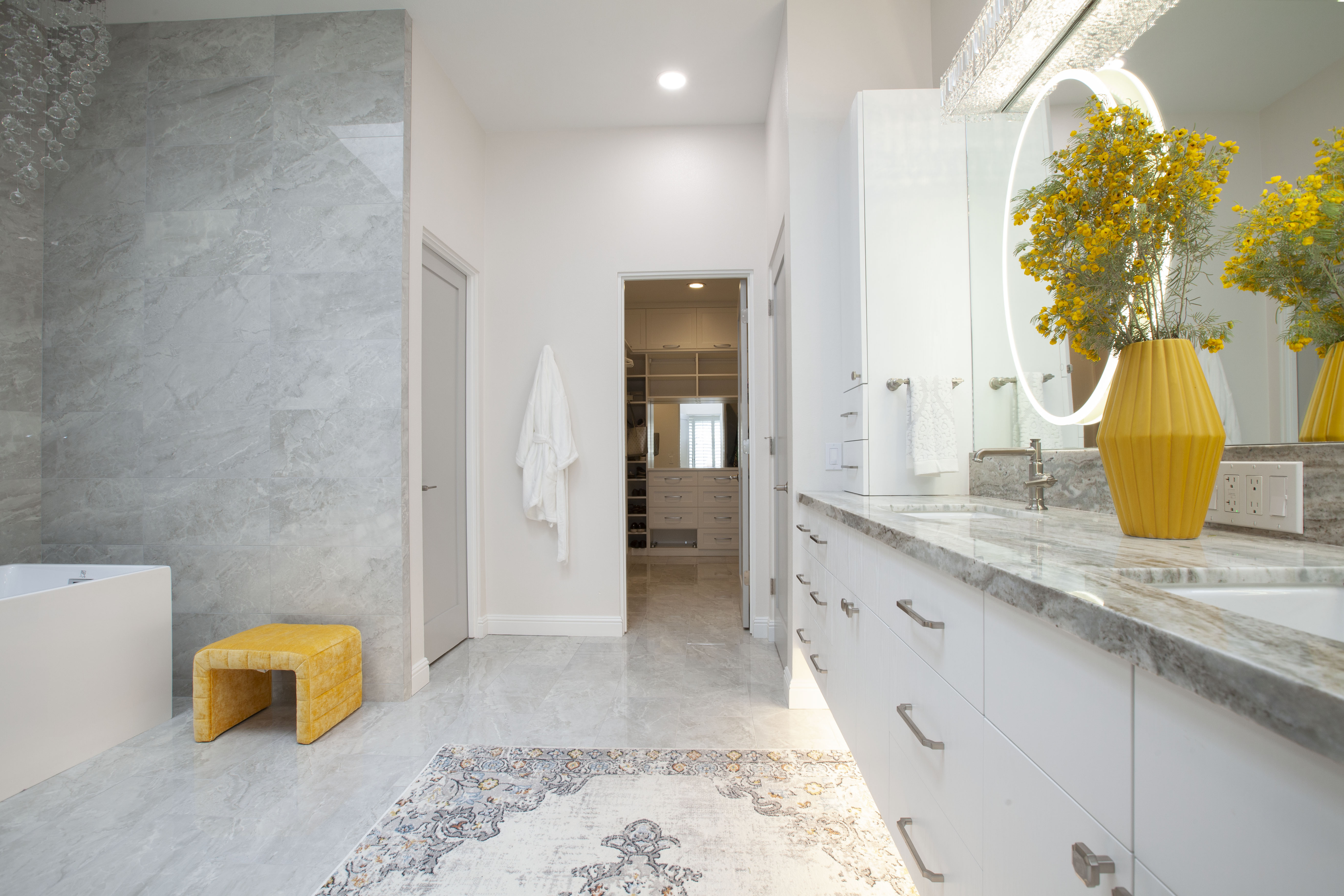 Room Addition & Whole-Home Renovation — master bath wide view showing vanity and walk-in closet