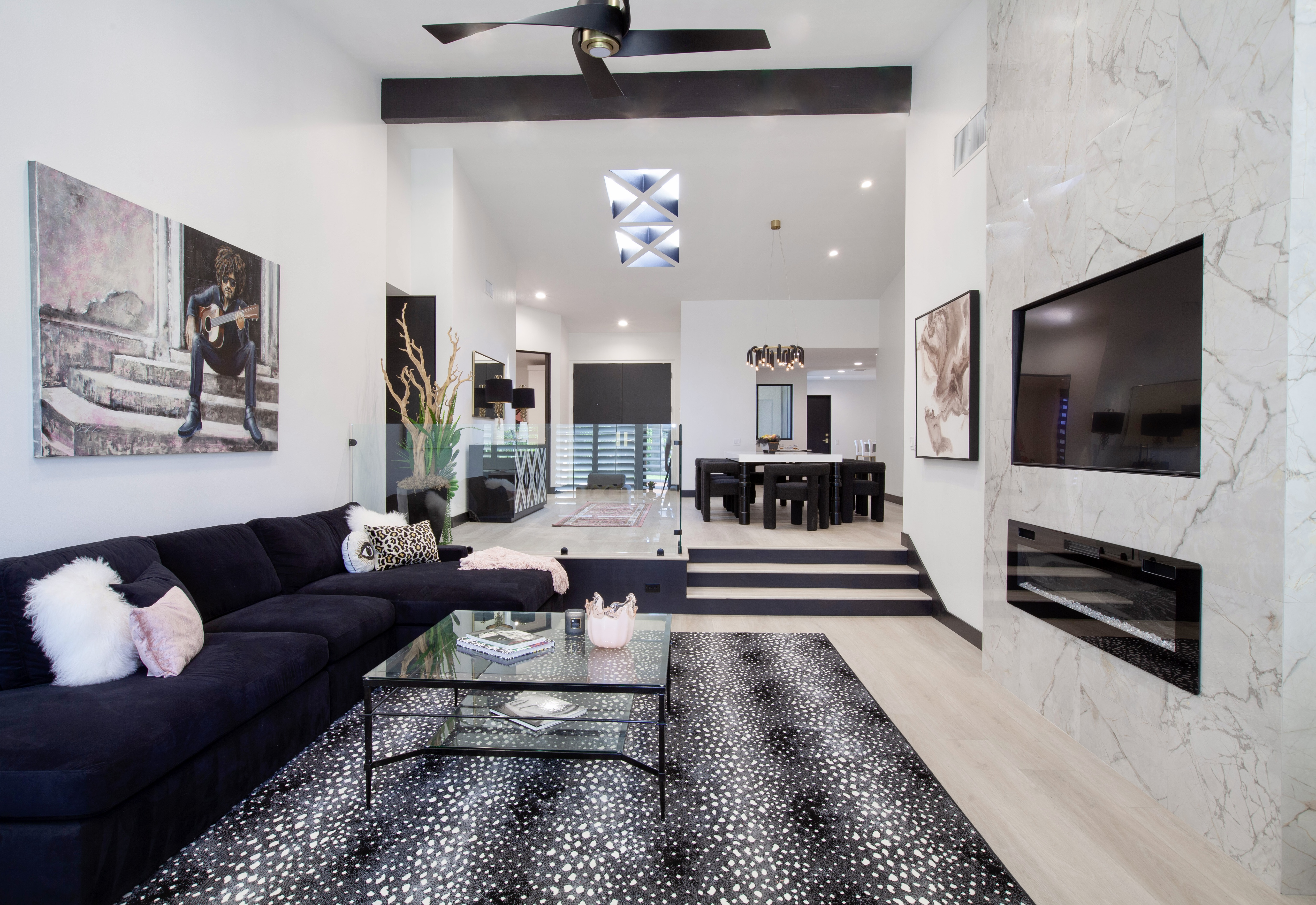 Desert Horizons Residence — living room with marble fireplace wall, soaring ceilings, open floor plan