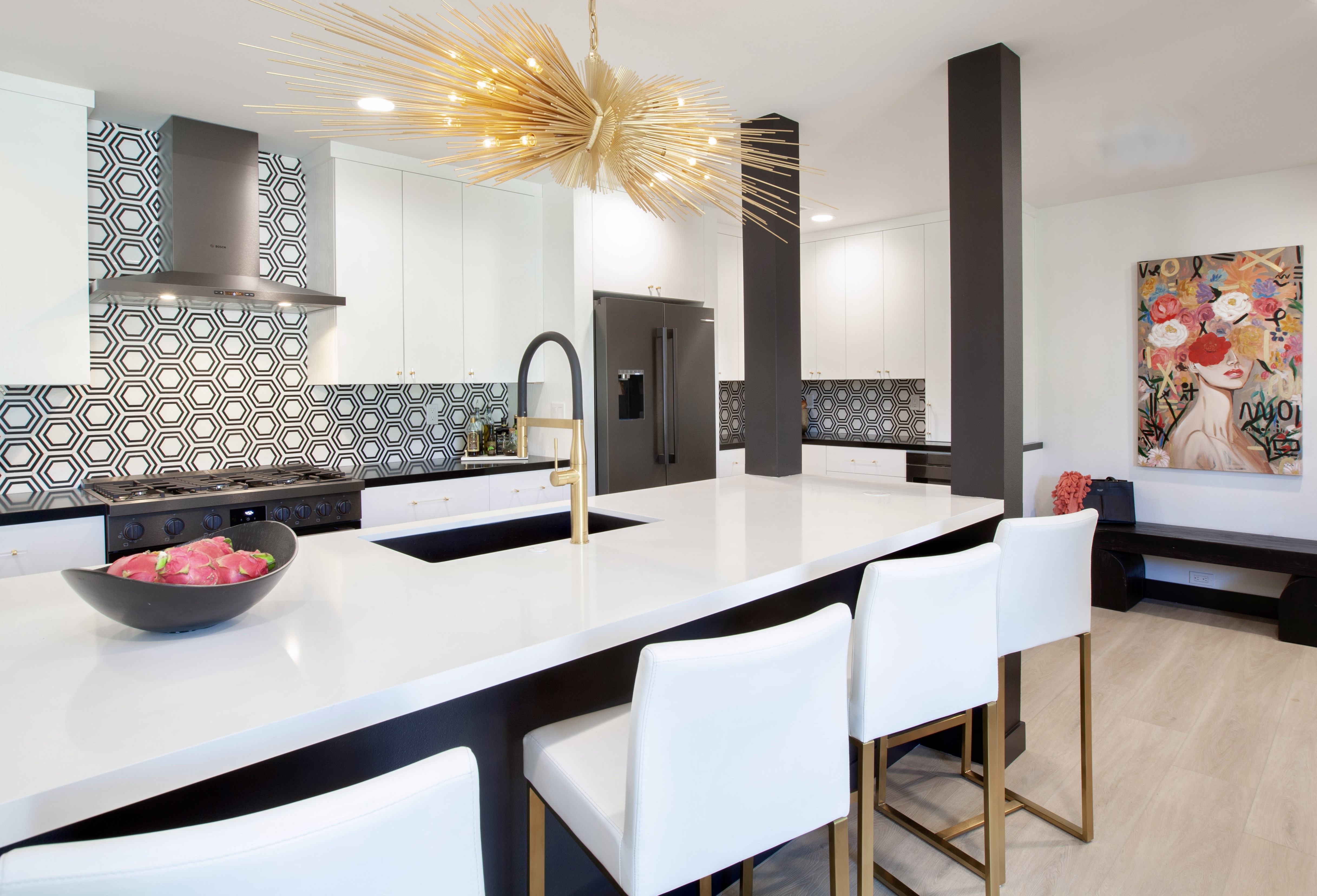 Desert Horizons Residence — kitchen with hexagon tile backsplash, white uppers, dark island with bar stools