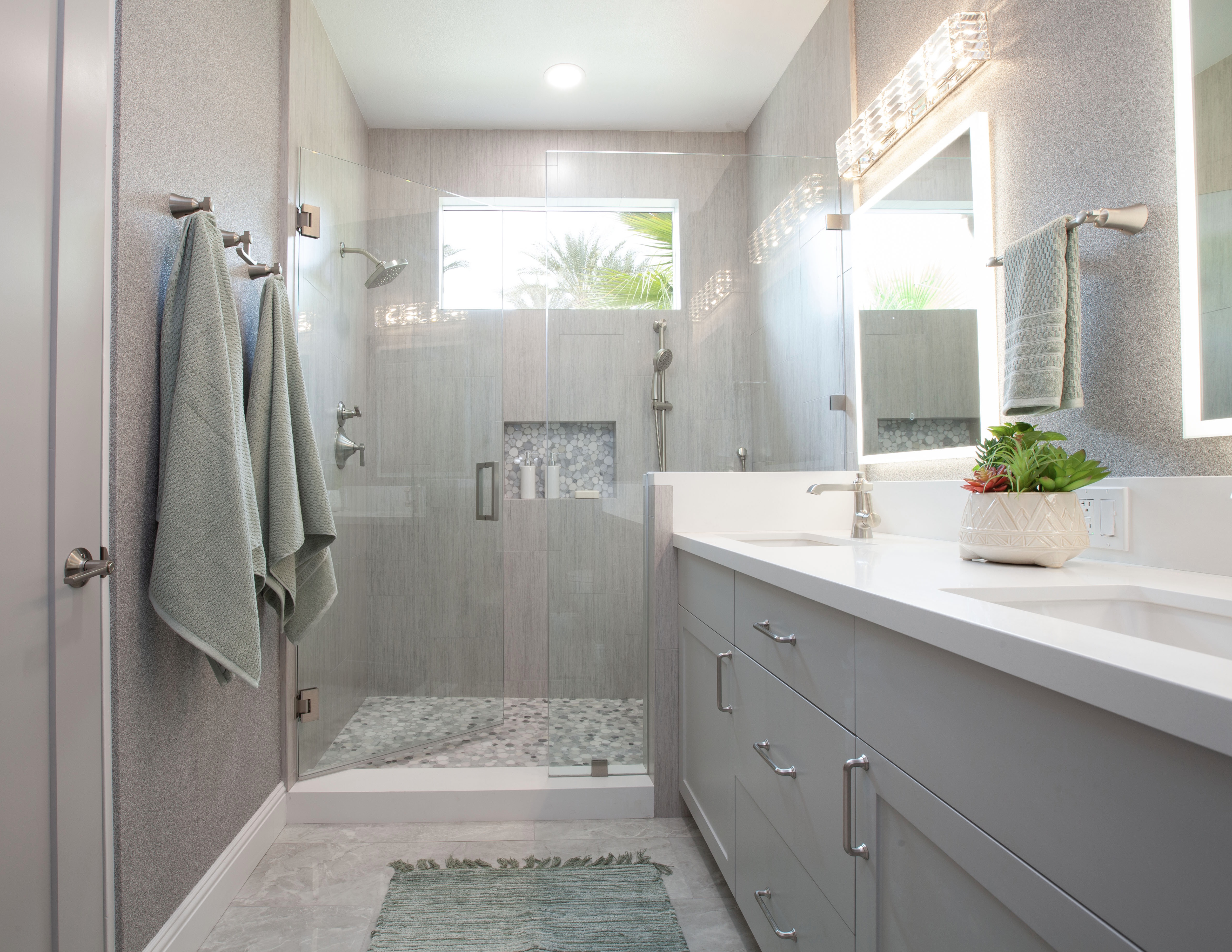 Multi-Bathroom Renovation — green bath showing full width with shower and double vanity