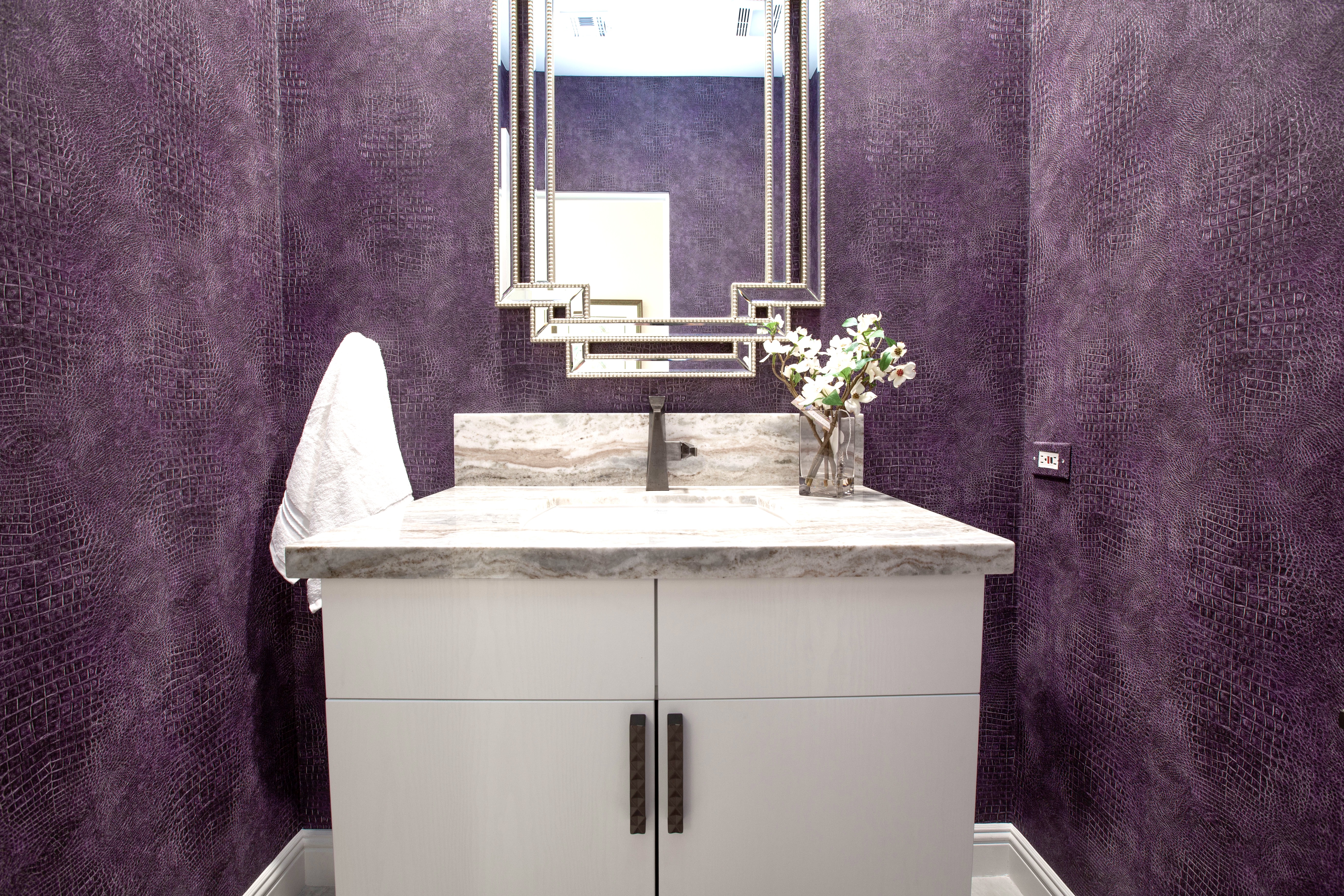 Multi-Bathroom Renovation — bold purple croc-texture wallpaper powder room